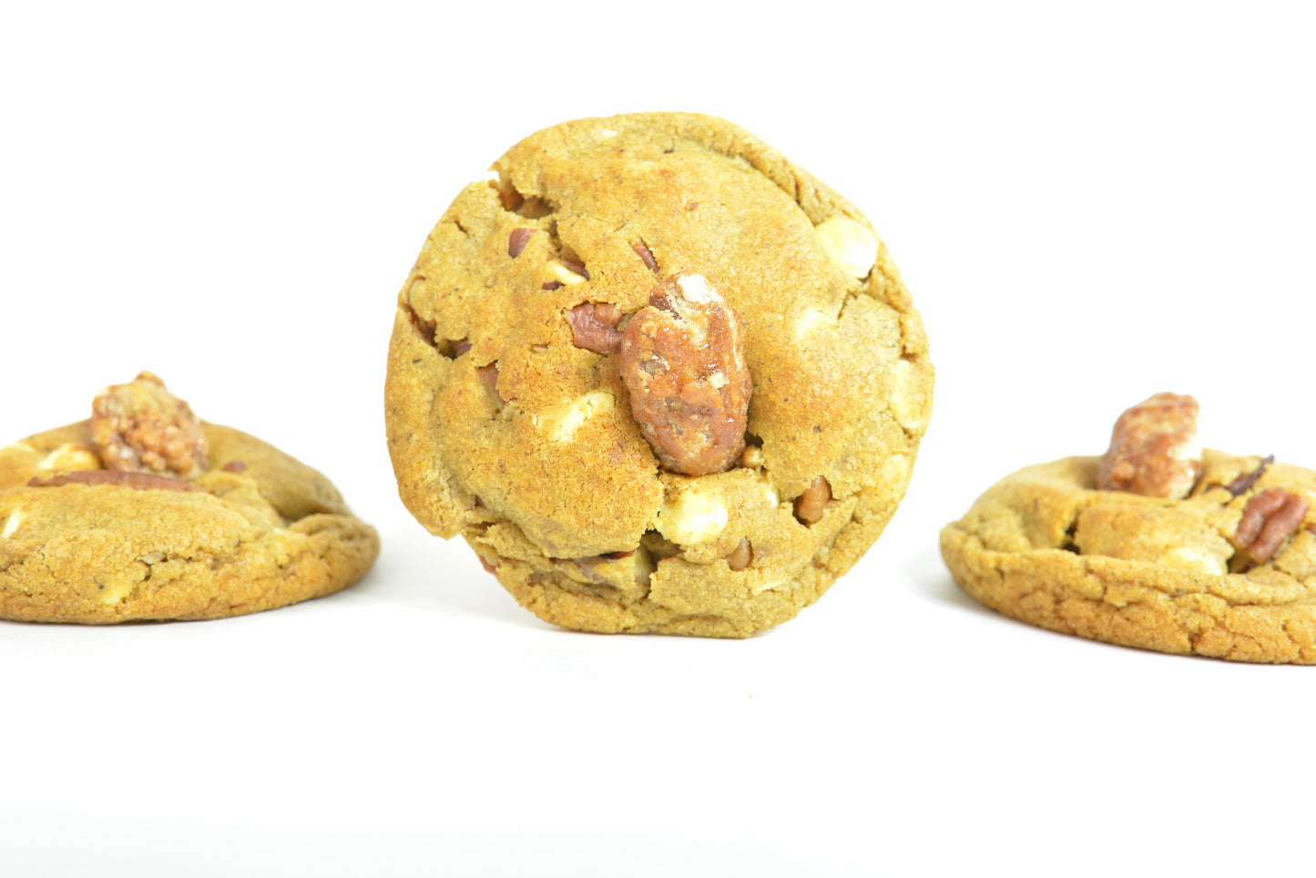 Pumpkin Spice Cookies. Enjoy the warm and comforting taste of pumpkin spice, paired with the satisfying crunch of buttery pecans and decadent white chocolate in our seasonal cookies.