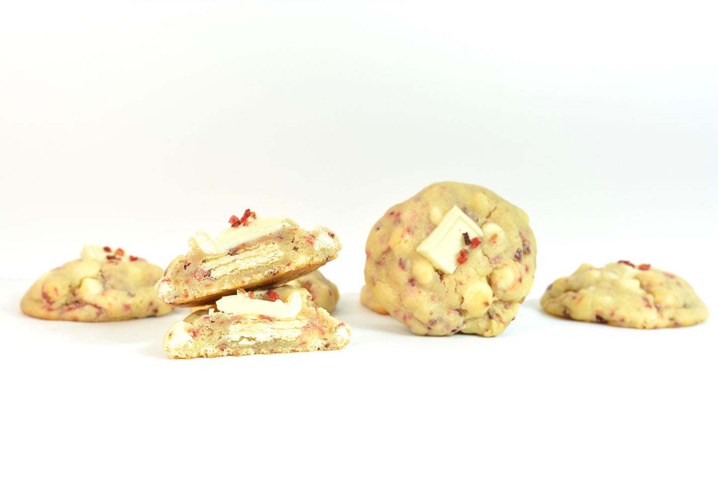 Lemon Strawberry Cookies. Our lemon strawberry cookies features rich lemon with strawberry bits, white chocolate chips, layered on top of a crispy vanilla wafer base