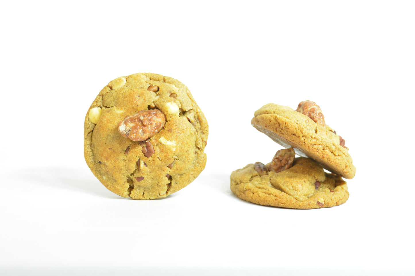 Pumpkin Spice Cookies. Enjoy the warm and comforting taste of pumpkin spice, paired with the satisfying crunch of buttery pecans and decadent white chocolate in our seasonal cookies.