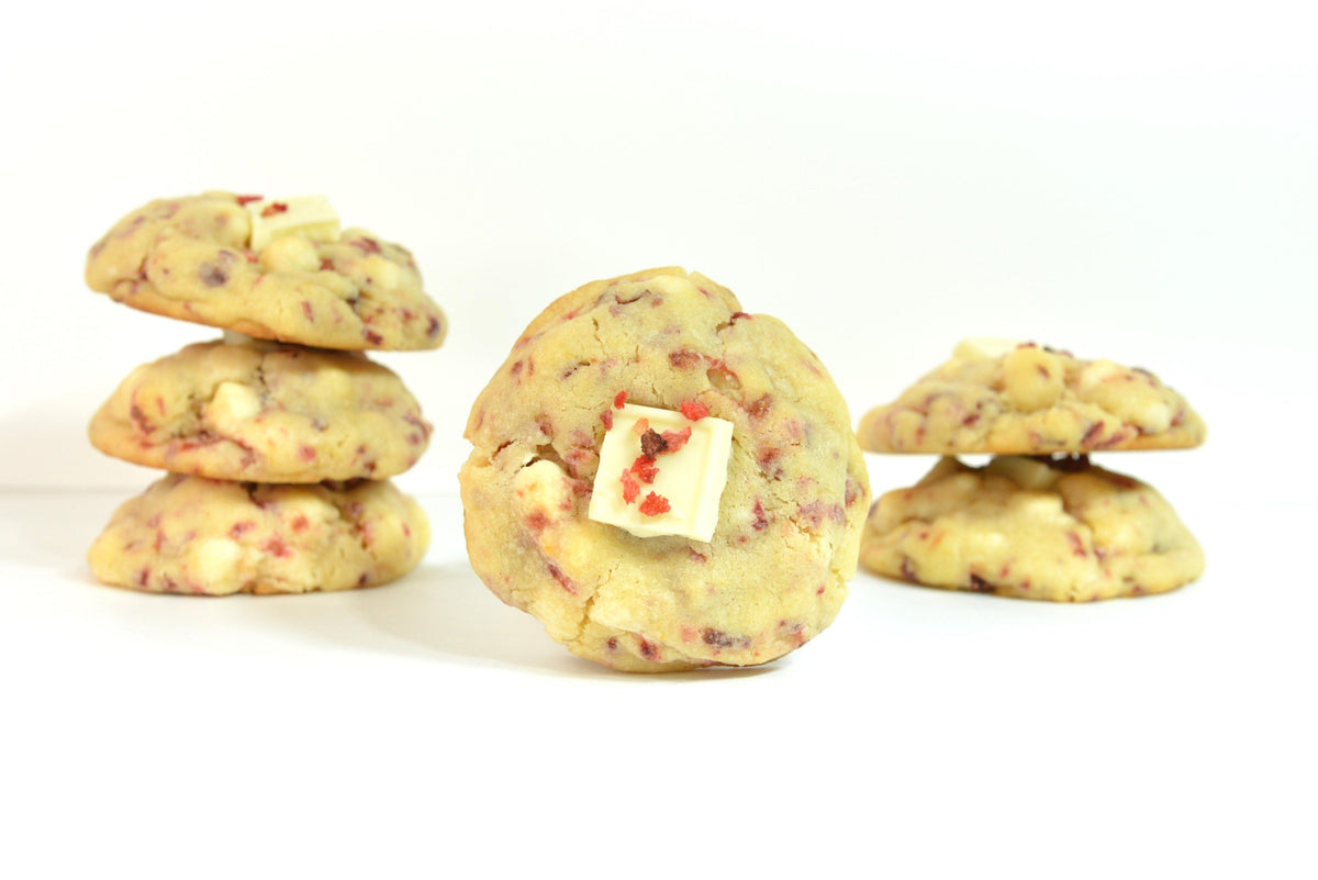 Lemon Strawberry Cookies. Our lemon strawberry cookies features rich lemon with strawberry bits, white chocolate chips, layered on top of a crispy vanilla wafer base