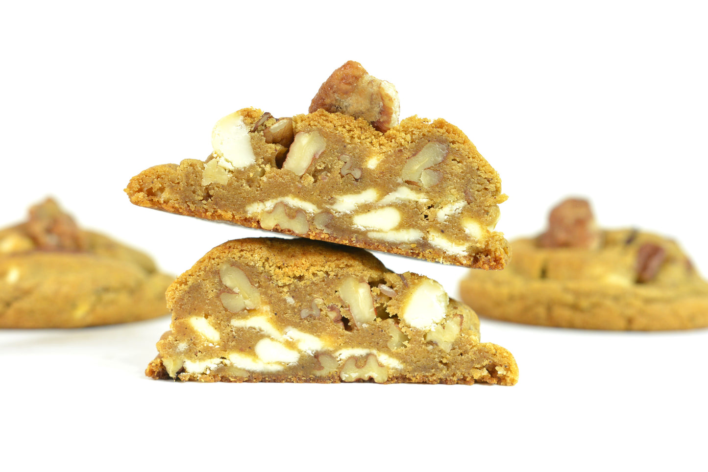 Pumpkin Spice Cookies. Enjoy the warm and comforting taste of pumpkin spice, paired with the satisfying crunch of buttery pecans and decadent white chocolate in our seasonal cookies.