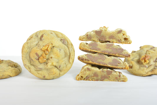 Milk Chocolate & Walnut Cookies. Savor the rich and velvety milk chocolate chips combined with crisp, flavorful walnuts in our milk chocolate & walnut cookies.