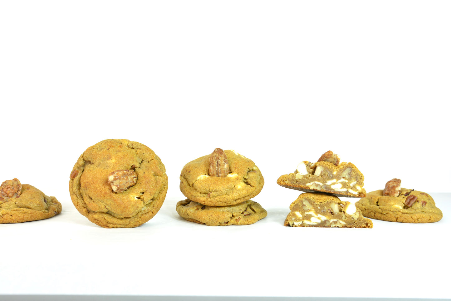 Pumpkin Spice Cookies. Enjoy the warm and comforting taste of pumpkin spice, paired with the satisfying crunch of buttery pecans and decadent white chocolate in our seasonal cookies.